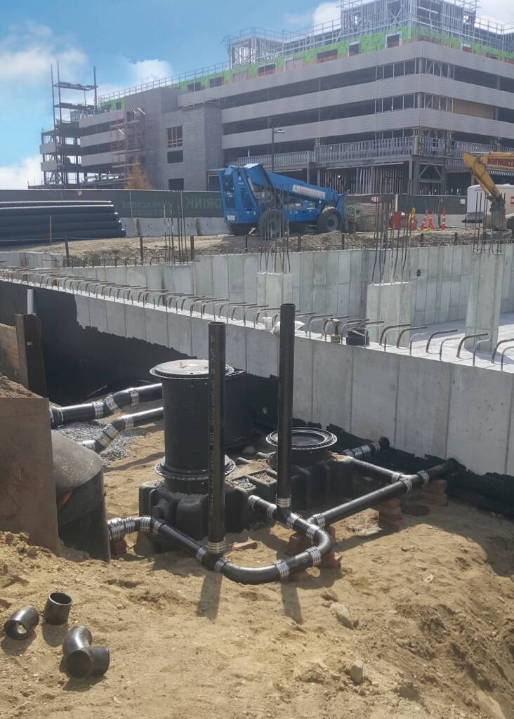 Arsenal Yards: Utility structure in active construction zone, showcasing intricate land planning and infrastructural development.