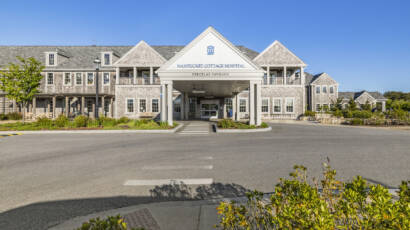 Nantucket Hospital front entrance with bushes and sunny day