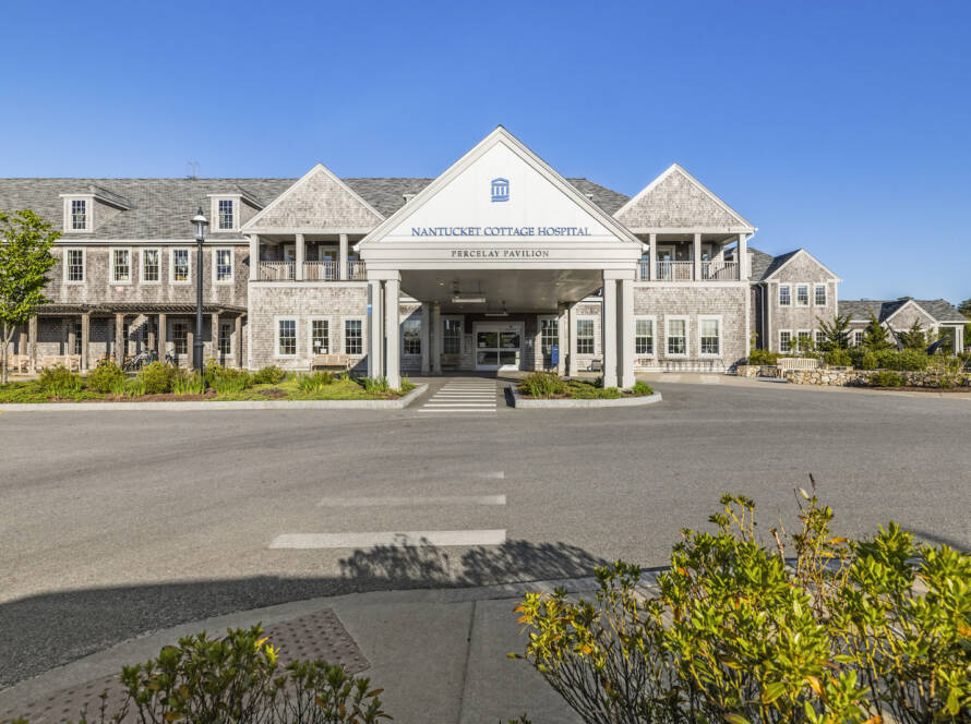 Nantucket Hospital front entrance with bushes and sunny day