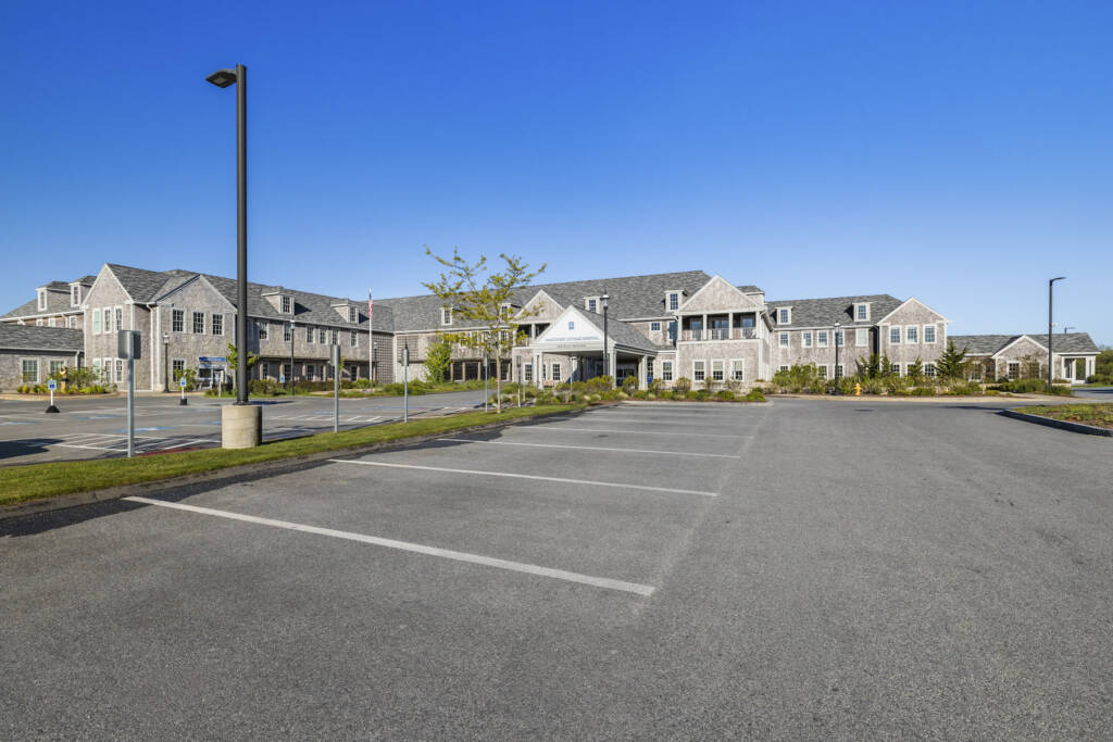 Nantucket Hospital full front of building in sunny daylight with parking lot