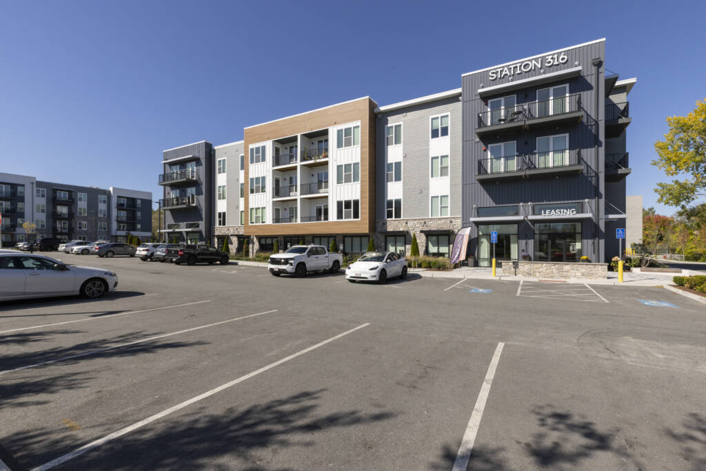 parking lot and apartment building at Station 316 Woburn
