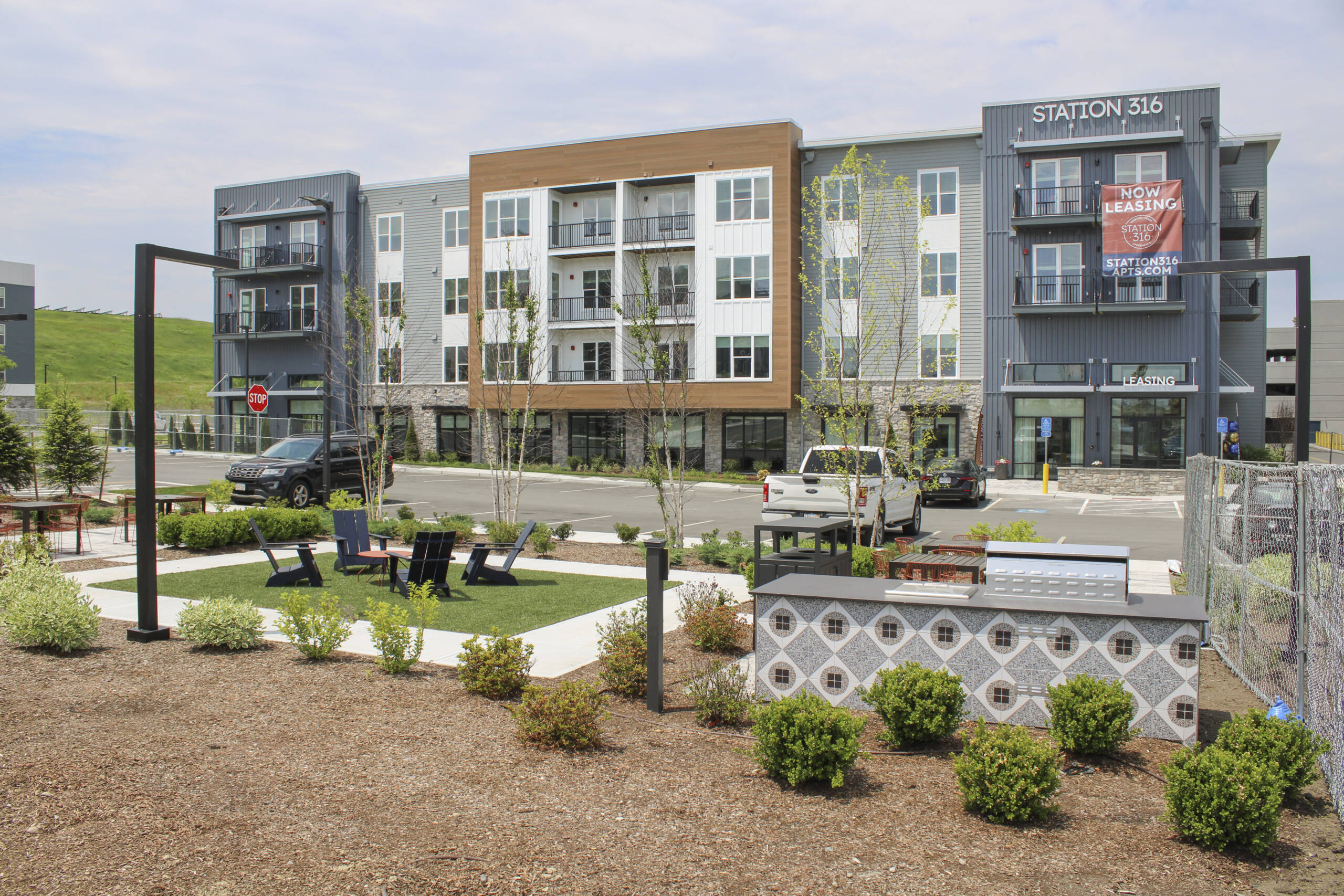 Modern apartment complex with landscaping.
