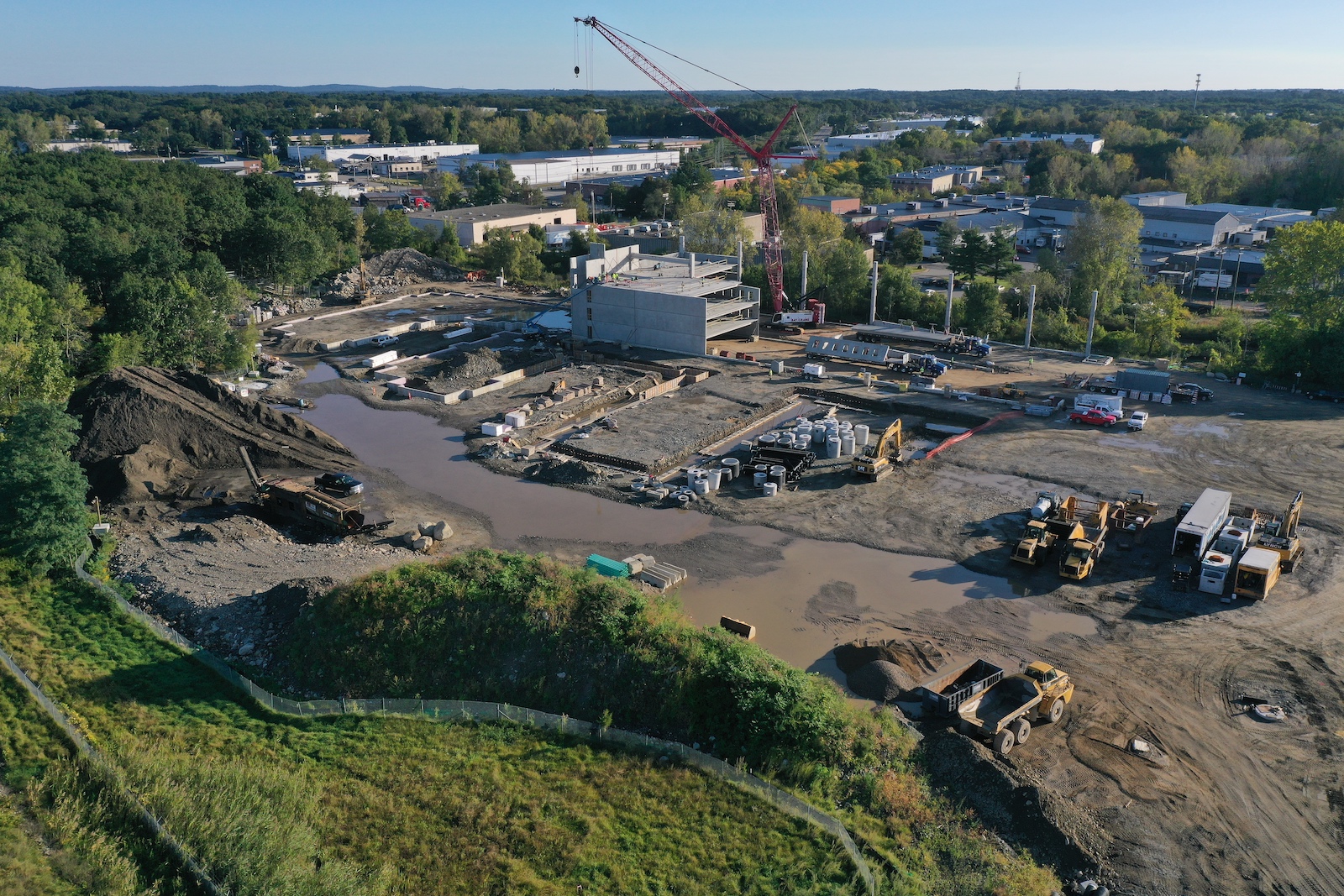 Construction site with heavy machinery visible.