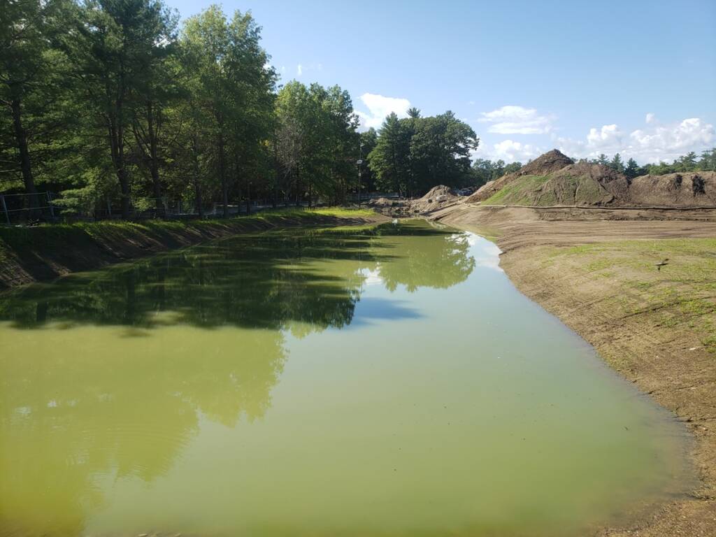 50 Nagog Park Acton MA green water with trees pre construction
