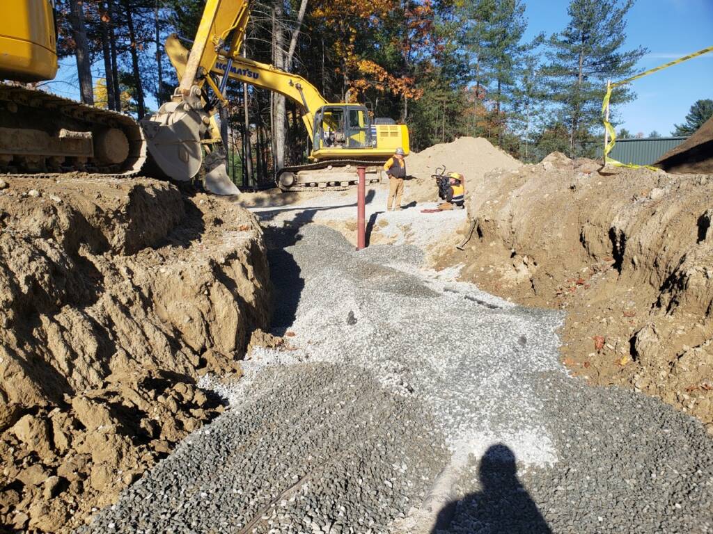 50 Nagog Park Acton MA construction zone with excavator and dirt mounds