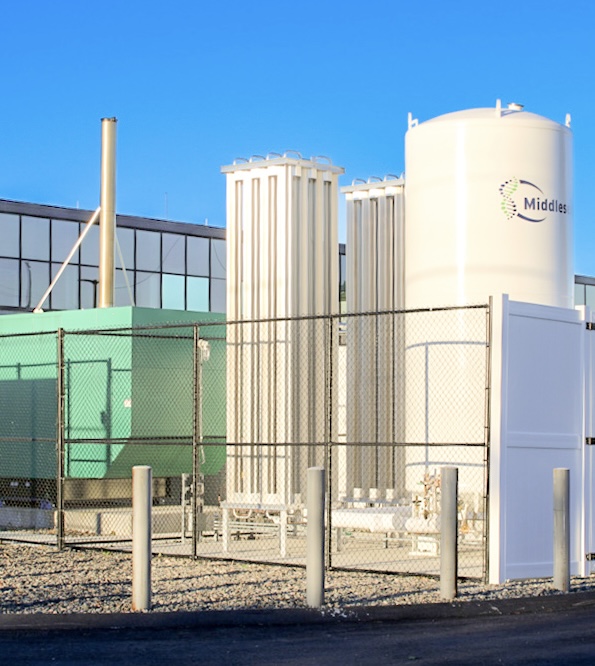 Gas and utility infrastructure at 24M Technologies facility in Westwood Massachusetts with storage tank, equipment, and secured service area