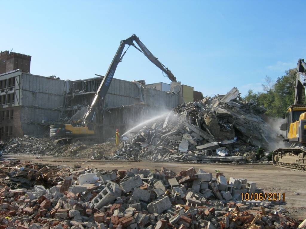 Heavy equipment demolishing portions of the former Sheraton Tara Hotel to prepare for the Hyatt Place project