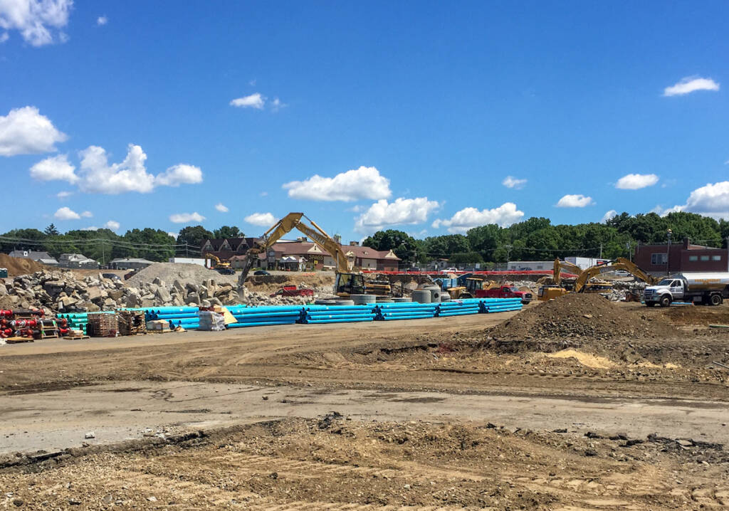 Construction site with heavy machinery and materials