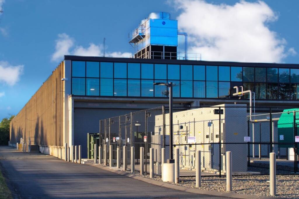 Exterior mechanical equipment and utility infrastructure at 24M Westwood facility including rooftop systems and secured service area