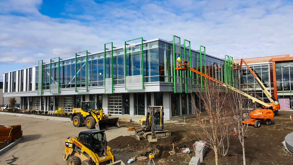 Modern building under construction with machinery
