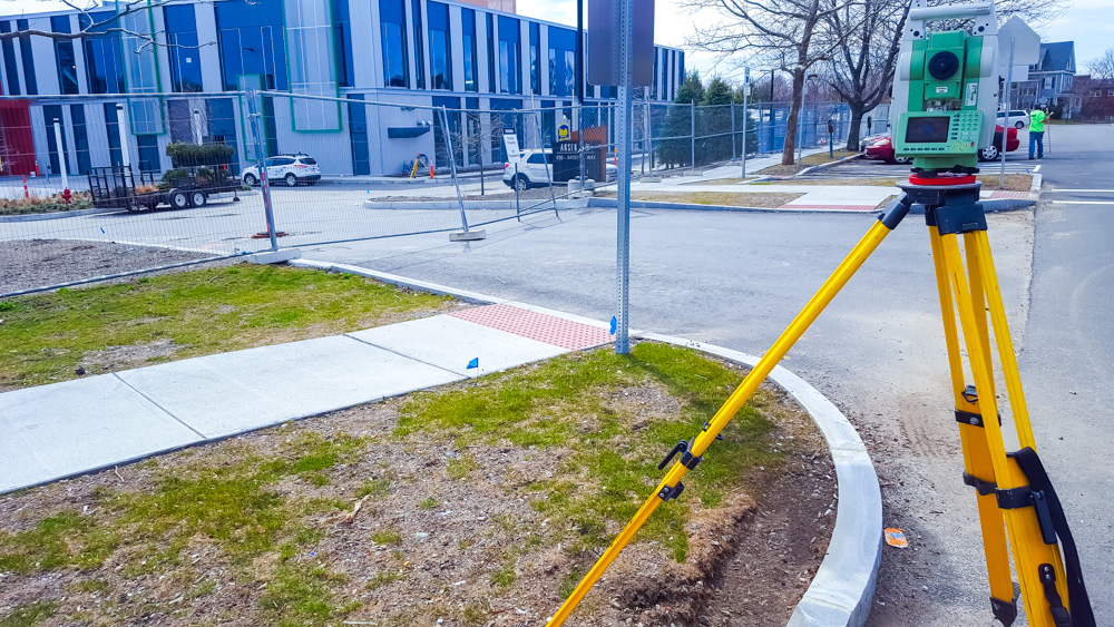 Surveying equipment near construction site