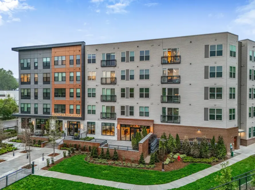 Hanover Stoneham apartment community exterior with modern façade, balconies, and landscaped entry in Stoneham, Massachusetts