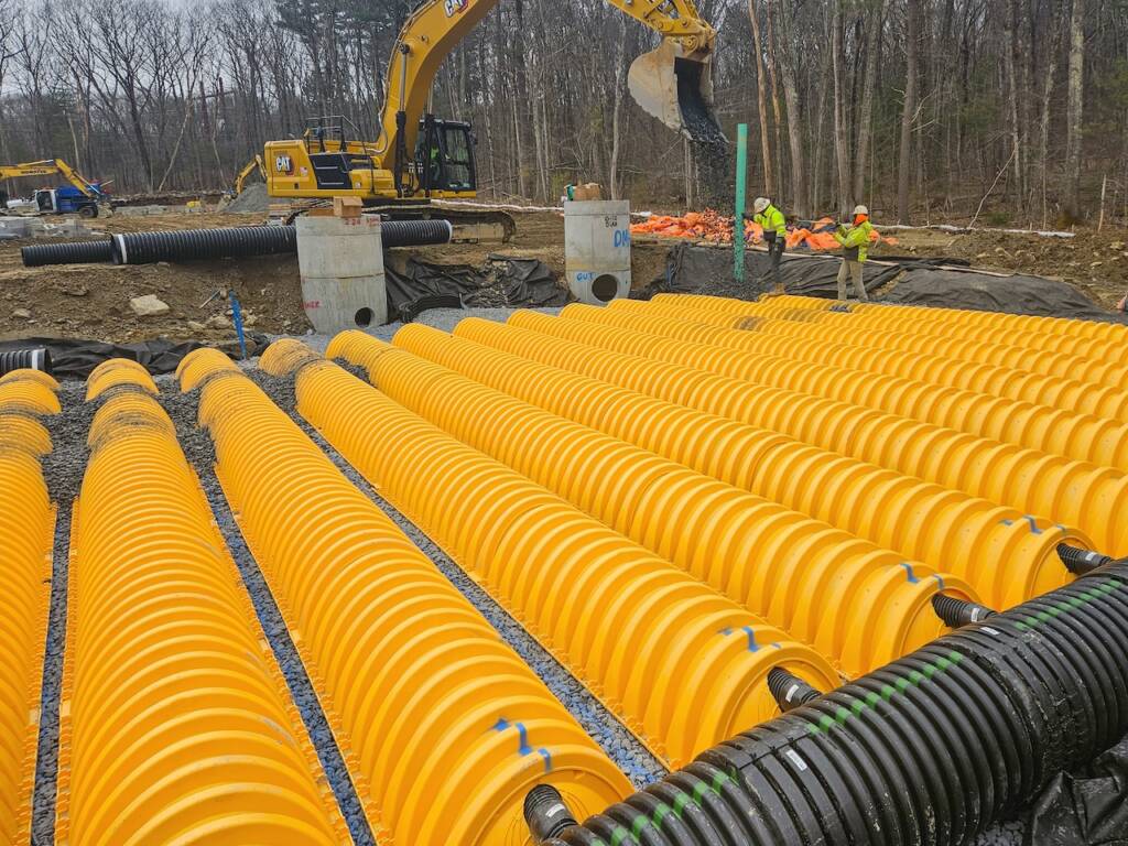 Construction site with yellow drainage pipes