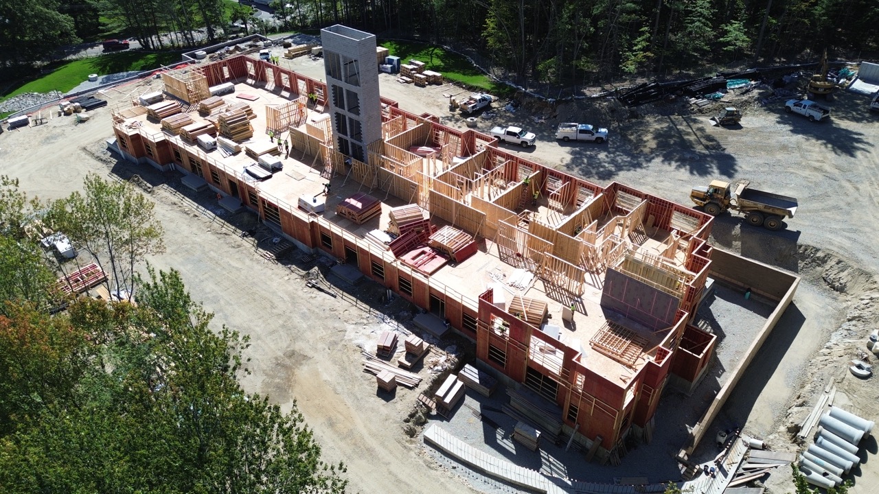 Aerial view of early site development, grading, and construction activity at Franklin Grove Apartments in Franklin, MA.